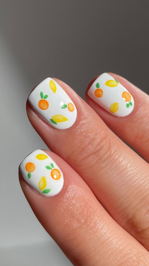 white nails with mango and oranges