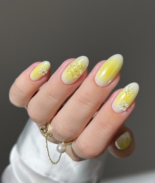 buttery soft aura with floral accents yellow nail art for summer